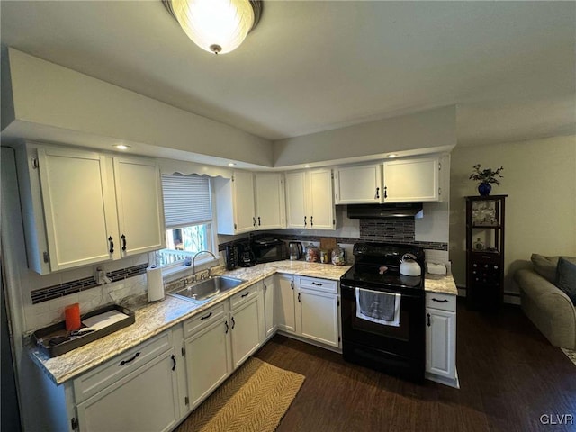 kitchen with decorative backsplash, white cabinetry, black / electric stove, dark hardwood / wood-style floors, and sink