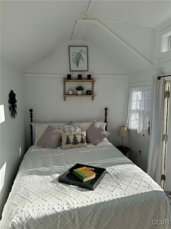 bedroom featuring vaulted ceiling