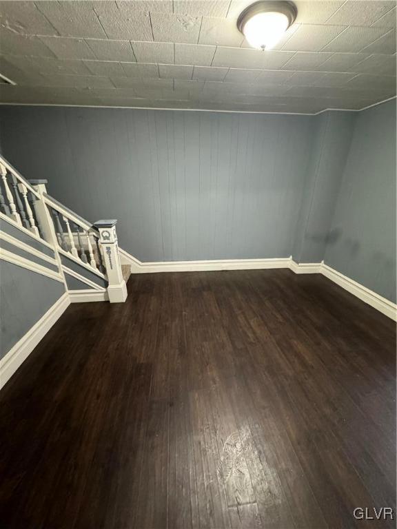 basement featuring dark hardwood / wood-style floors