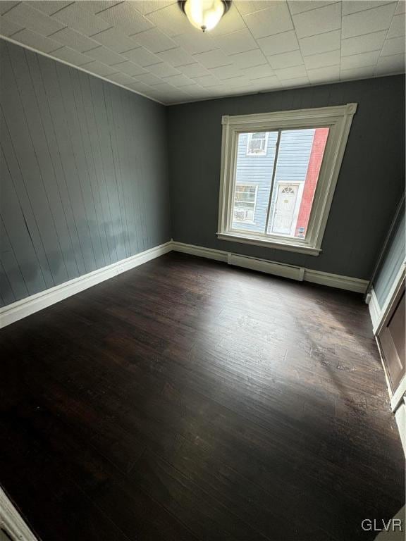 empty room featuring dark hardwood / wood-style floors