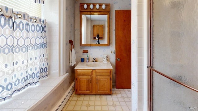 bathroom featuring vanity and curtained shower