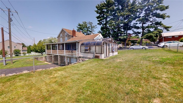 view of yard with a sunroom