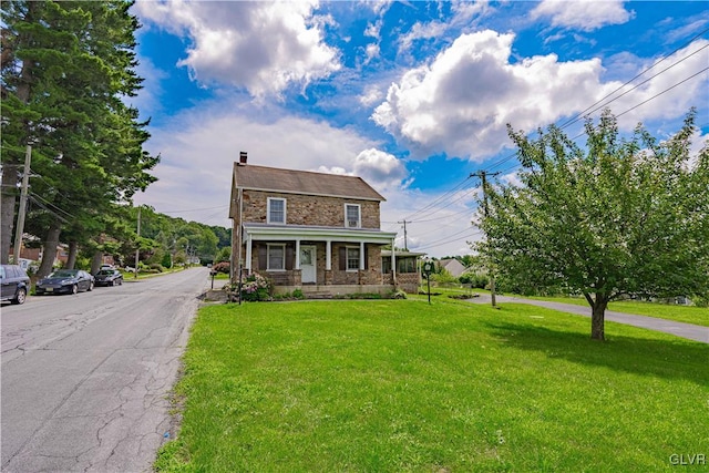 view of front of home featuring a front lawn and a porch