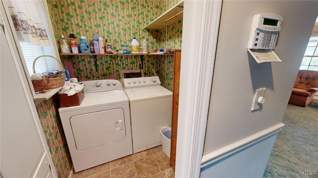 laundry area with light carpet and washing machine and dryer