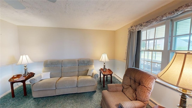 living room with a baseboard radiator, carpet, and a textured ceiling