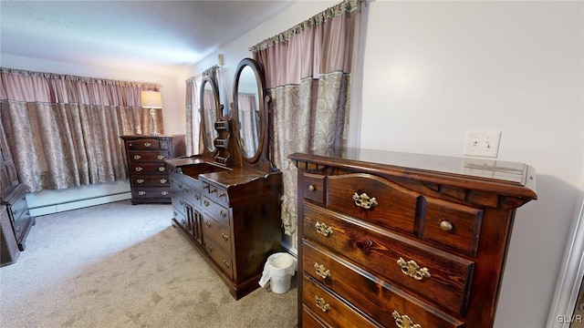 carpeted bedroom featuring baseboard heating