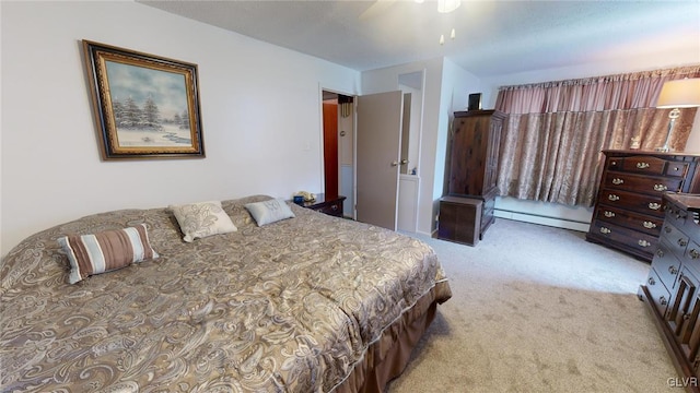 bedroom featuring a baseboard radiator, light carpet, and ceiling fan