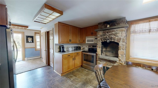 kitchen featuring appliances with stainless steel finishes and a baseboard radiator