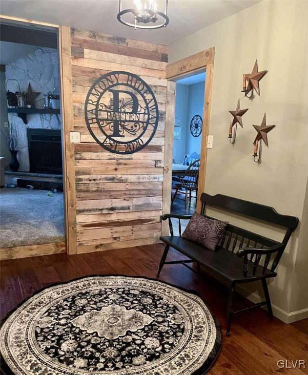 interior space featuring hardwood / wood-style floors and a notable chandelier