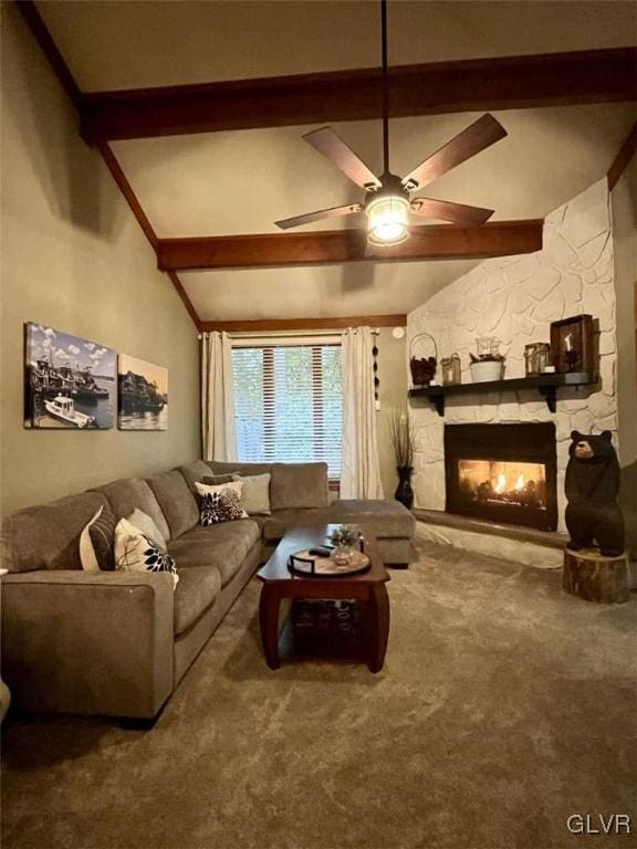 living room featuring ceiling fan, a stone fireplace, lofted ceiling with beams, and carpet