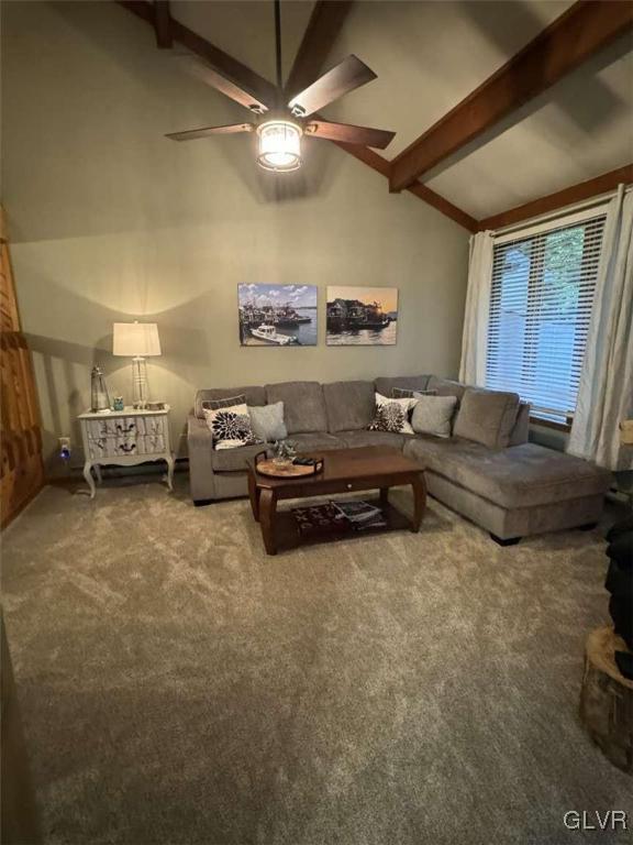 carpeted living room with lofted ceiling with beams and ceiling fan