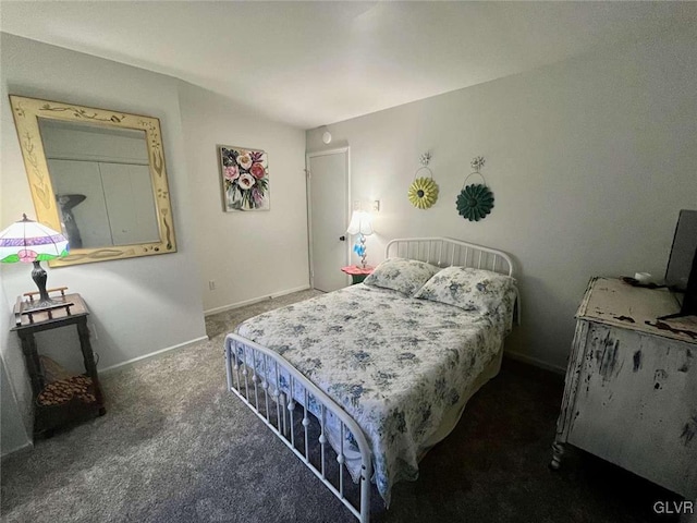 bedroom featuring dark carpet