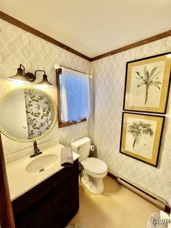 bathroom featuring vanity, a baseboard radiator, toilet, and ornamental molding