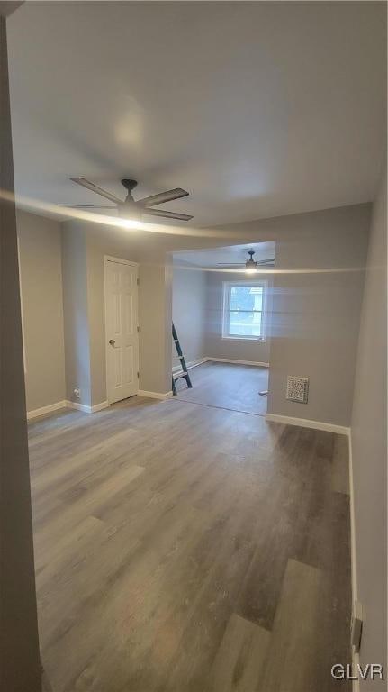 spare room featuring wood-type flooring