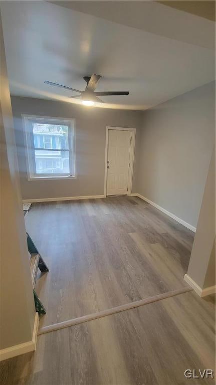 spare room featuring ceiling fan and hardwood / wood-style floors