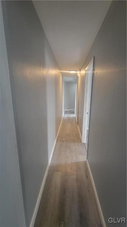 hall with light hardwood / wood-style floors