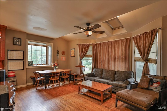 living room featuring hardwood / wood-style floors, ceiling fan, and plenty of natural light