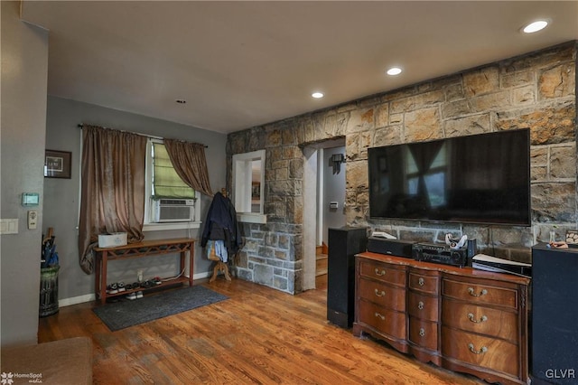 living room featuring hardwood / wood-style floors and cooling unit