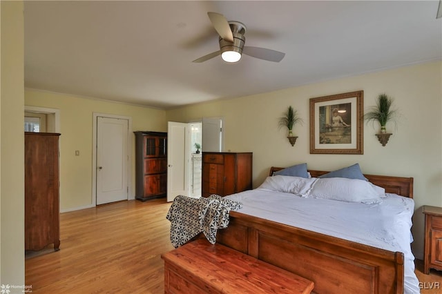 bedroom with light hardwood / wood-style floors and ceiling fan