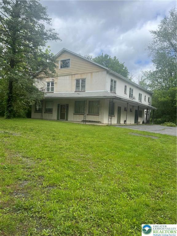 403 N Walnut St, Bath Borough, PA 18014 - view of front facade with a front lawn