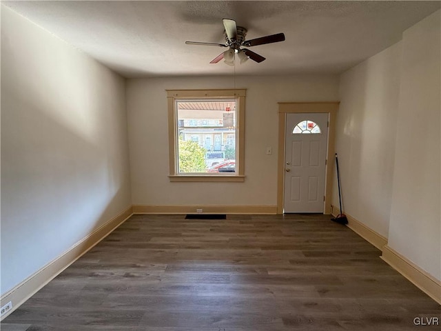 foyer featuring dark hardwood / wood-style floors and ceiling fan