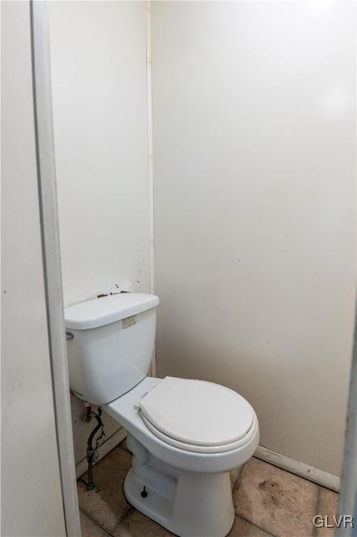 bathroom with tile patterned flooring and toilet