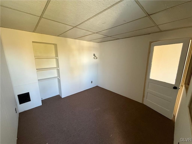 spare room featuring a paneled ceiling