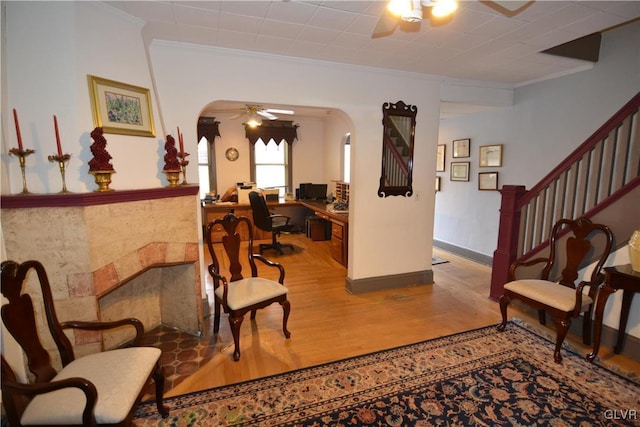 162 S Union St, Easton, PA 18042 - sitting room with a ceiling fan, wood finished floors, arched walkways, ornamental molding, and an office area