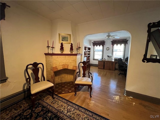 162 S Union St, Easton, PA 18042 - sitting room featuring arched walkways, wood finished floors, ceiling fan, and a desk