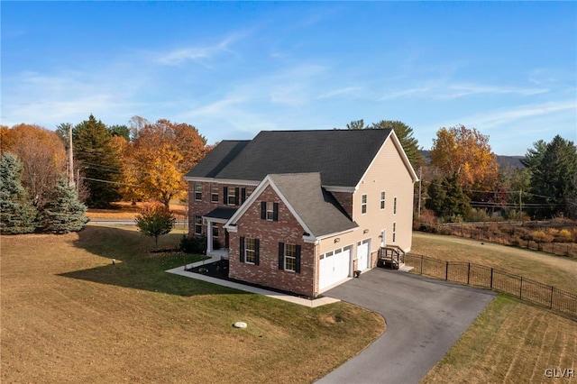 view of front of home with a garage and a front yard