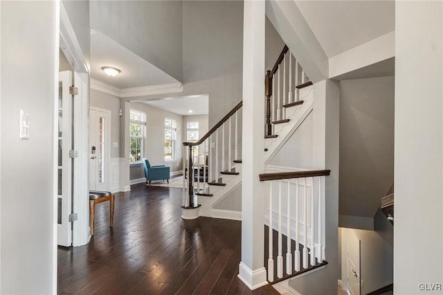 foyer entrance with dark hardwood / wood-style floors