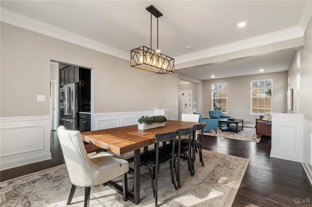 dining area featuring dark hardwood / wood-style flooring and ornamental molding