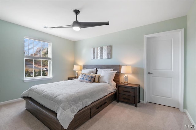 carpeted bedroom featuring ceiling fan