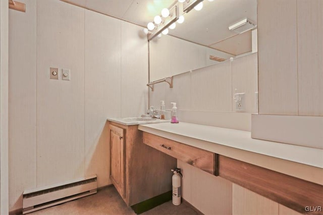 bathroom featuring vanity and baseboard heating