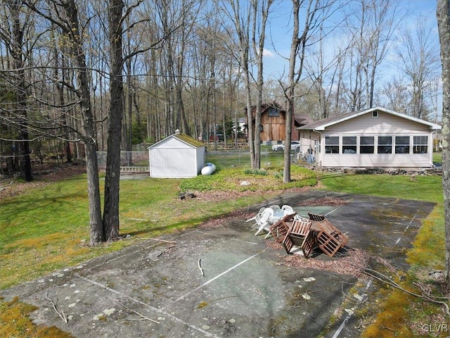 view of patio / terrace featuring a storage unit