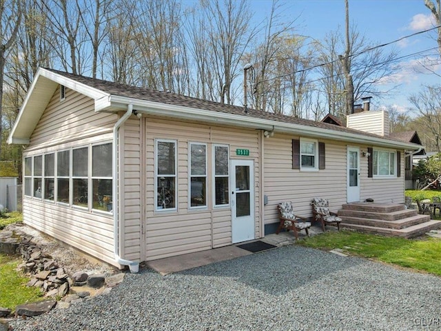 view of front of house featuring a patio area and a sunroom