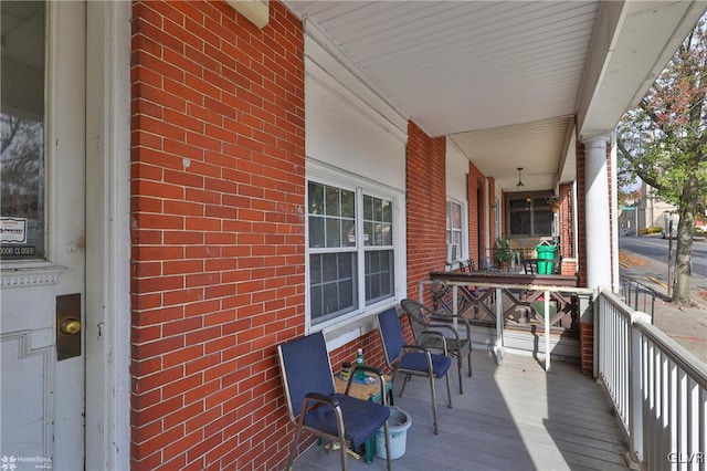 wooden terrace with a porch