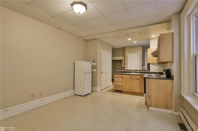 kitchen with white fridge, light brown cabinetry, sink, electric range oven, and a baseboard radiator