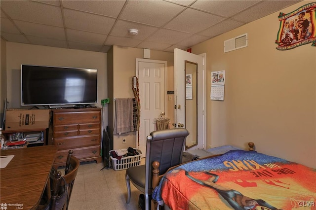 bedroom featuring a paneled ceiling