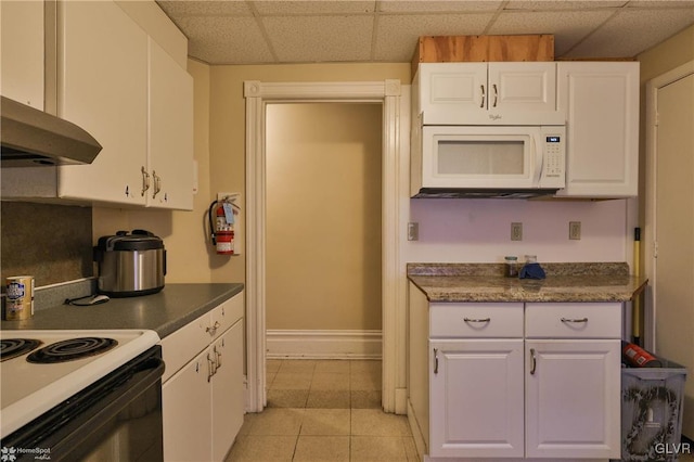 kitchen featuring white cabinetry, a paneled ceiling, light tile patterned flooring, and white appliances