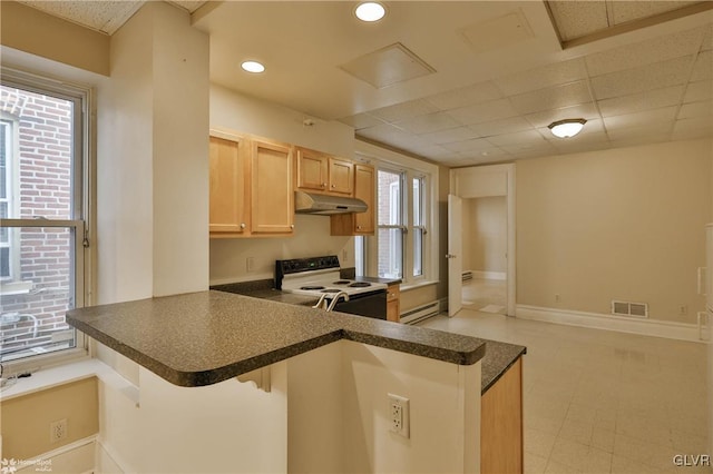 kitchen featuring a breakfast bar area, light brown cabinetry, a baseboard radiator, kitchen peninsula, and white electric range