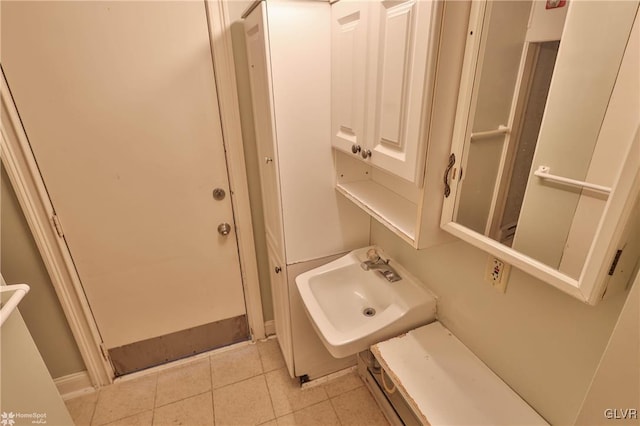 bathroom with tile patterned flooring and sink