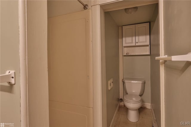 bathroom featuring toilet and tile patterned floors