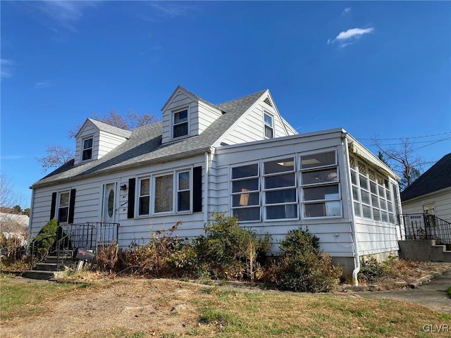 view of front of property featuring a sunroom