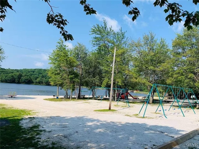 view of jungle gym with a water view