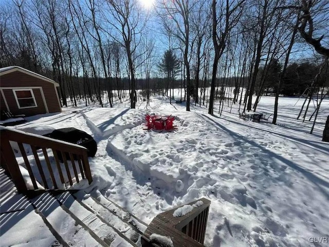 view of yard layered in snow