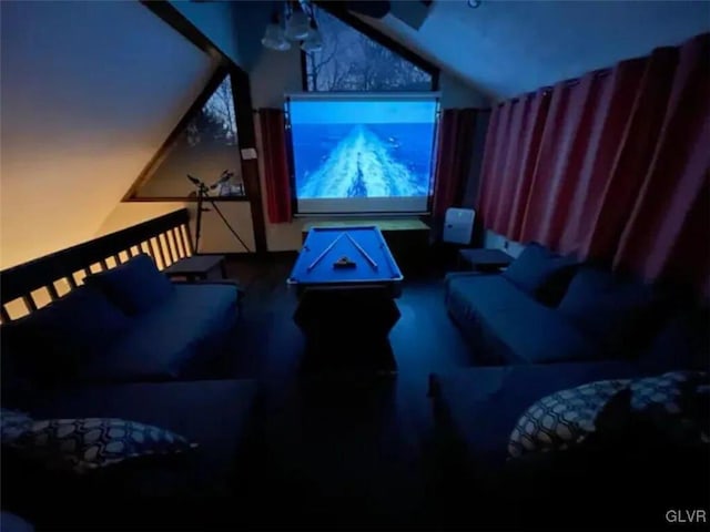 home theater room featuring ceiling fan and lofted ceiling