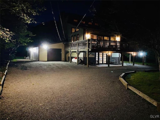 view of front facade featuring a deck and a garage