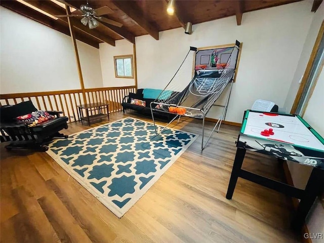 sitting room with ceiling fan, wooden ceiling, wood-type flooring, and beam ceiling