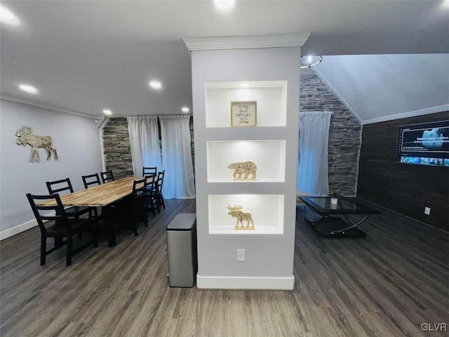 kitchen featuring lofted ceiling, built in shelves, dark hardwood / wood-style floors, and crown molding